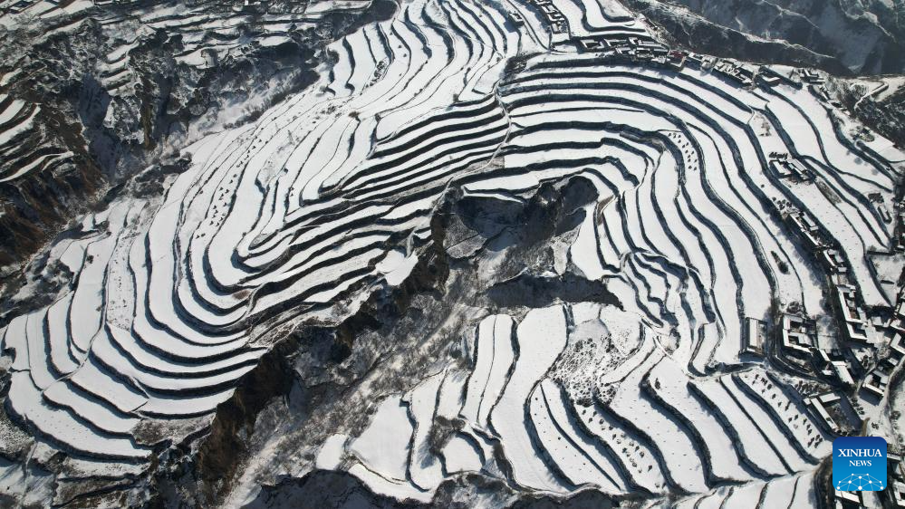 Snow scenery of terraced fields in China's Gansu