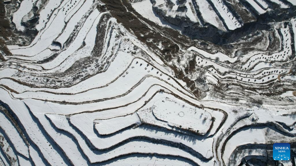 Snow scenery of terraced fields in China's Gansu