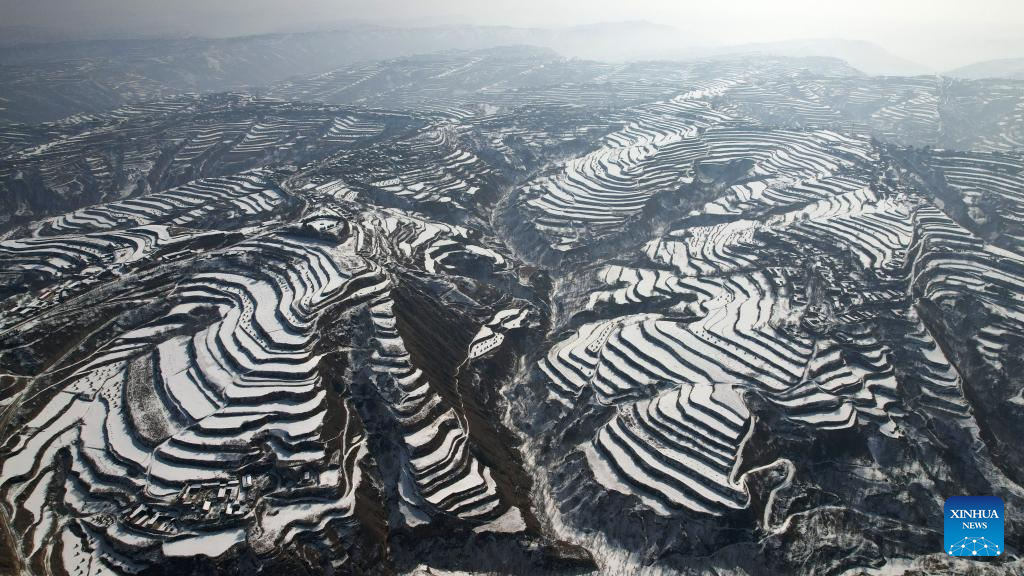 Snow scenery of terraced fields in China's Gansu