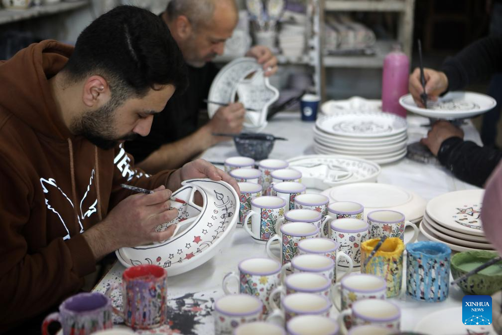 Palestinian workers make ceramic handicrafts in West Bank