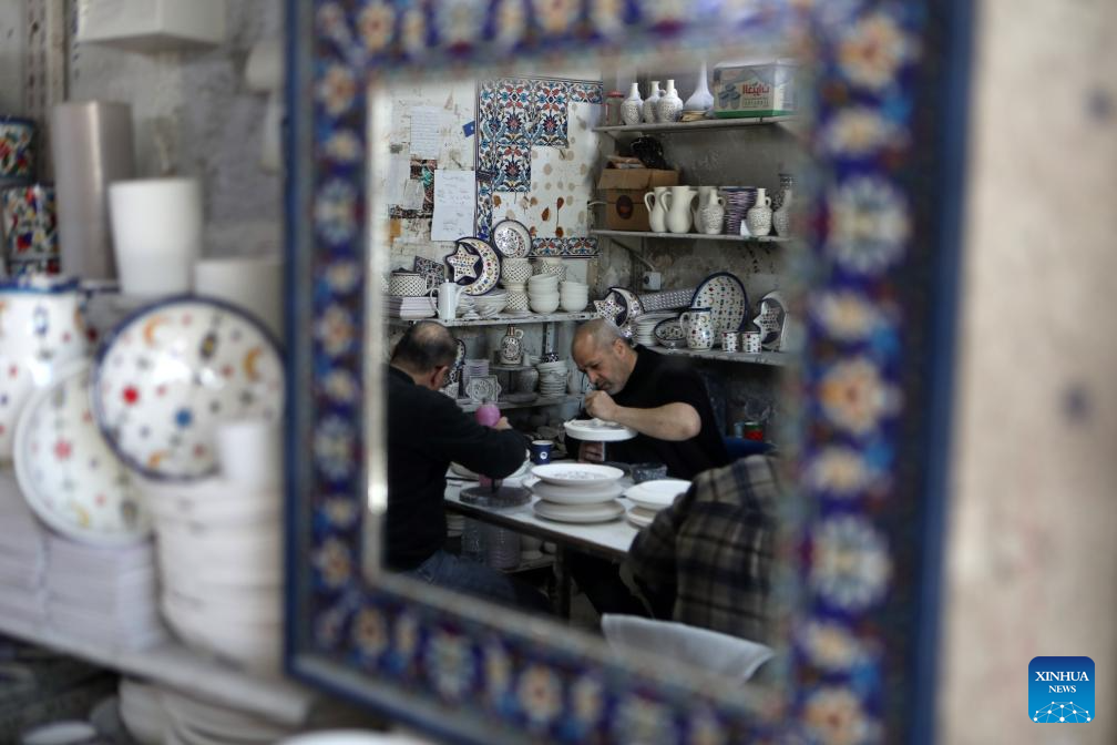 Palestinian workers make ceramic handicrafts in West Bank