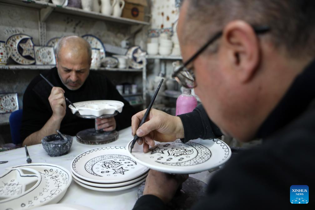 Palestinian workers make ceramic handicrafts in West Bank