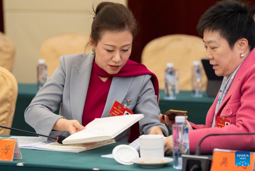 Gov't work report in Braille shows China's care, support for people with disabilities