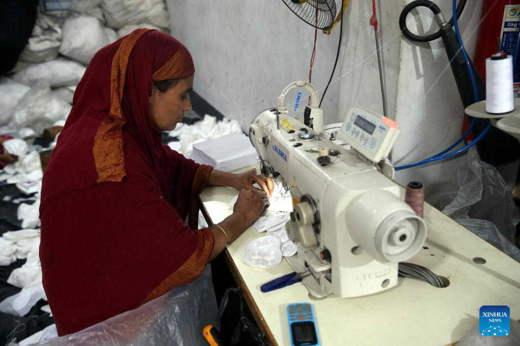 Workers produce prayer caps before Eid-ul-Fitr in Bangladesh