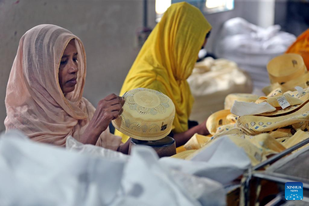 Workers produce prayer caps before Eid-ul-Fitr in Bangladesh