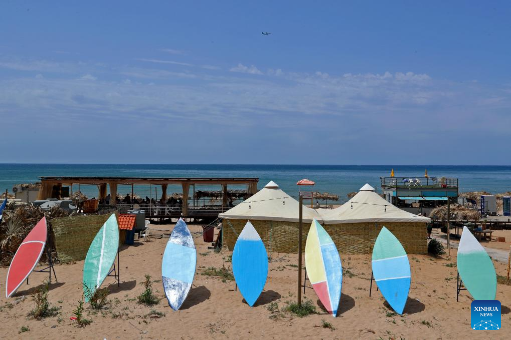 People enjoy themselves on beach in Beirut, Lebanon