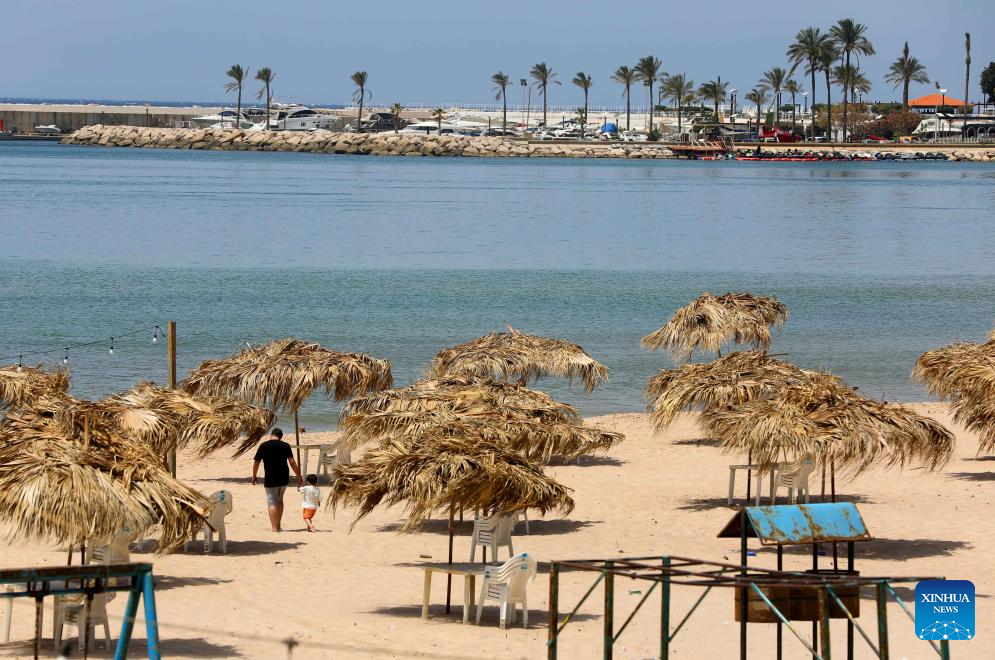 People enjoy themselves on beach in Beirut, Lebanon