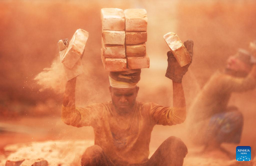People work at brick factory in Dhaka, Bangladesh