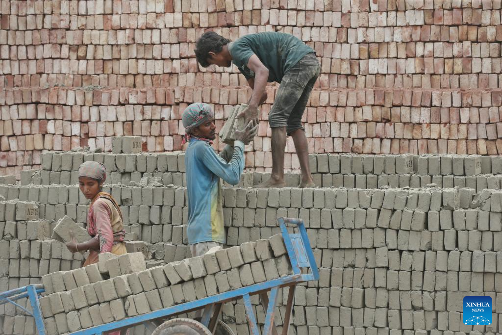 People work at brick factory in Dhaka, Bangladesh