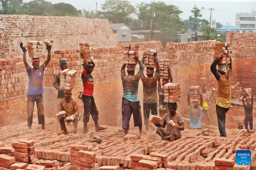 People work at brick factory in Dhaka, Bangladesh