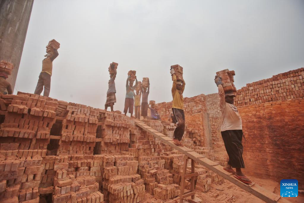 People work at brick factory in Dhaka, Bangladesh