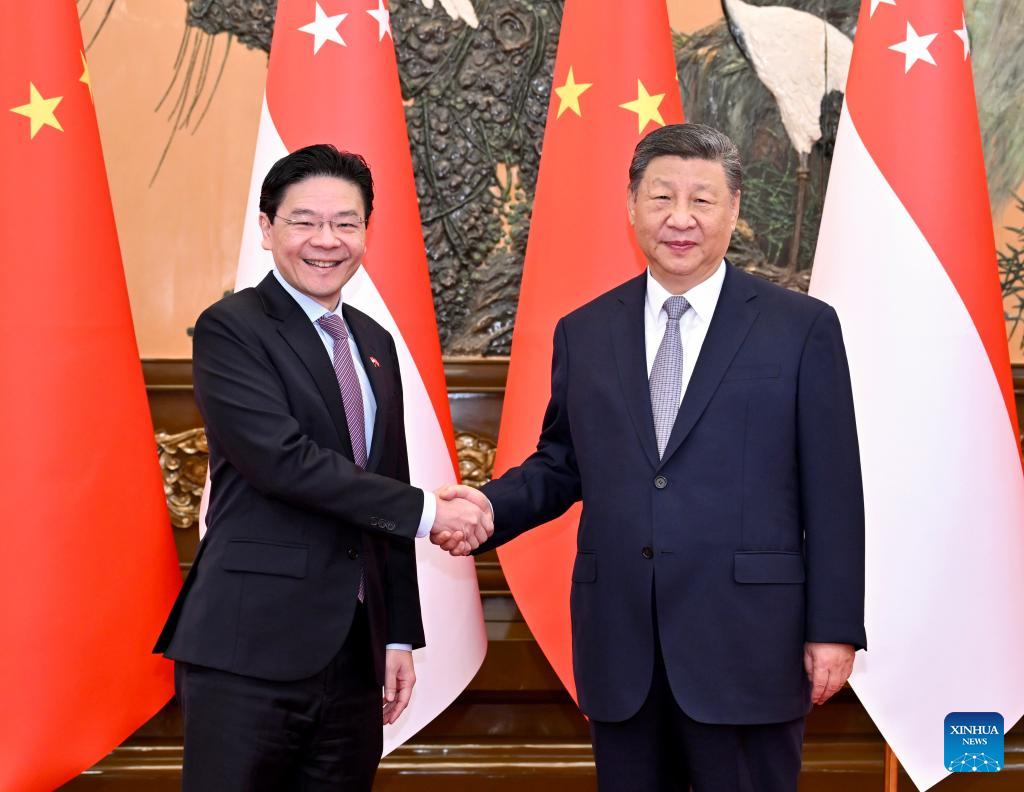 Xi meets Singaporean PM
