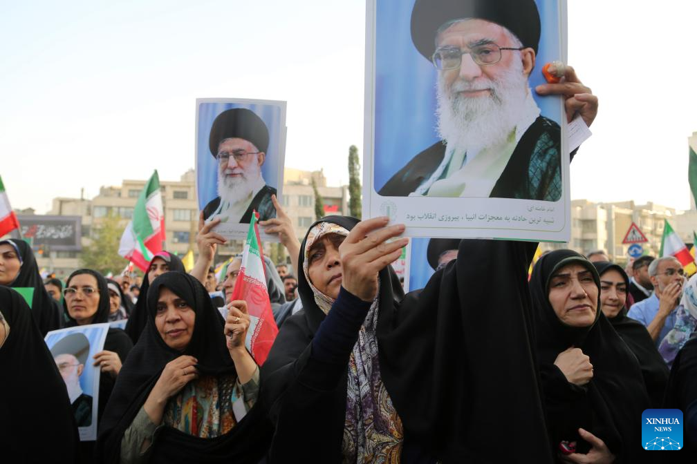 People celebrate ceasefire between Iran, Israeal at Enghelab Square in Tehran