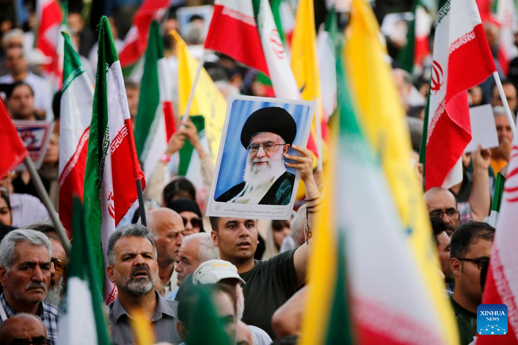 People celebrate ceasefire between Iran, Israeal at Enghelab Square in Tehran