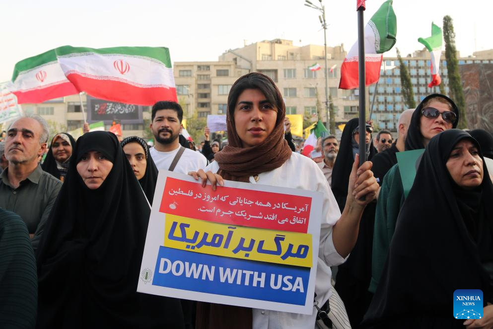 People celebrate ceasefire between Iran, Israeal at Enghelab Square in Tehran