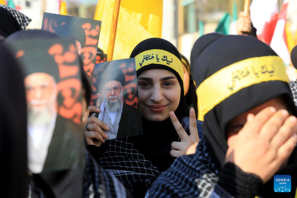 Lebanese people gather outside Iranian Embassy carrying pictures of Iranian Supreme Leader