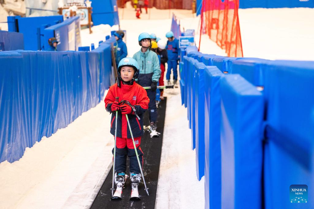 People enjoy themselves at indoor ski resort in Changsha