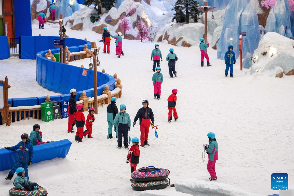 People enjoy themselves at indoor ski resort in Changsha