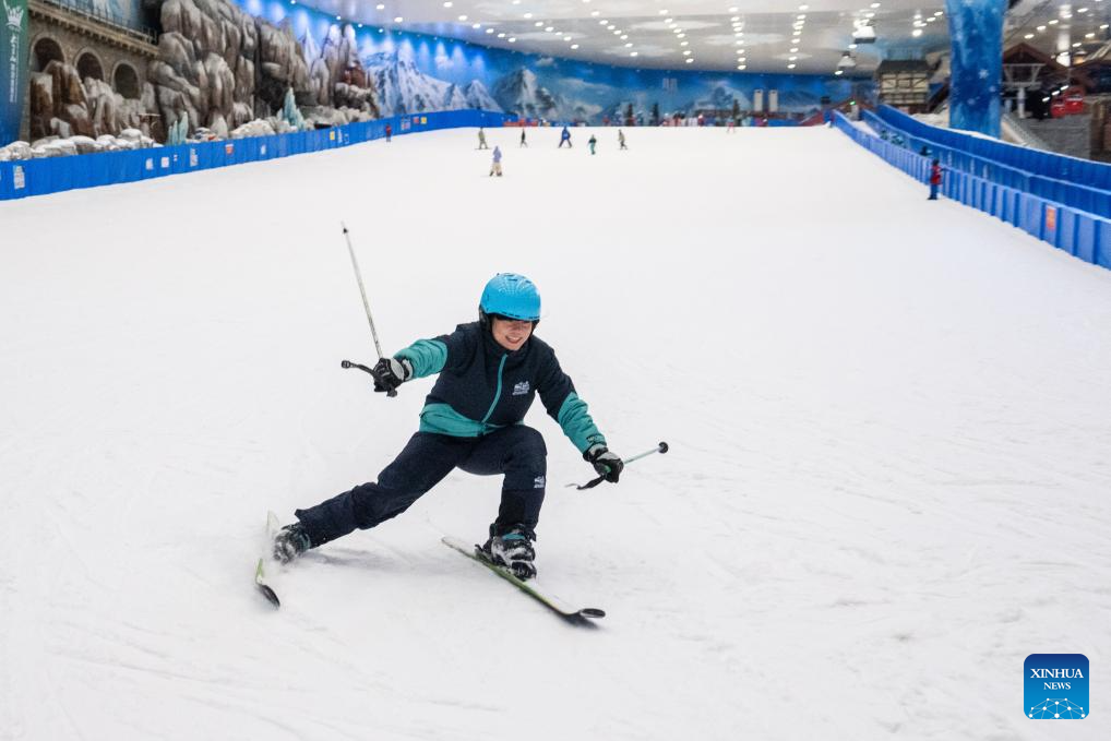 People enjoy themselves at indoor ski resort in Changsha