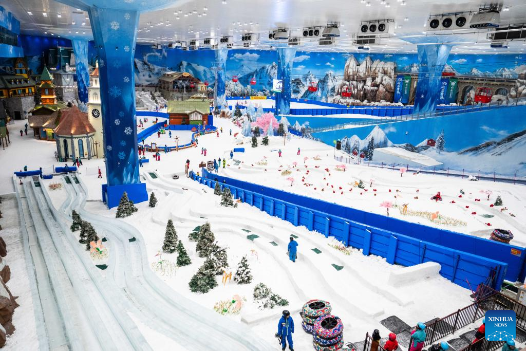 People enjoy themselves at indoor ski resort in Changsha