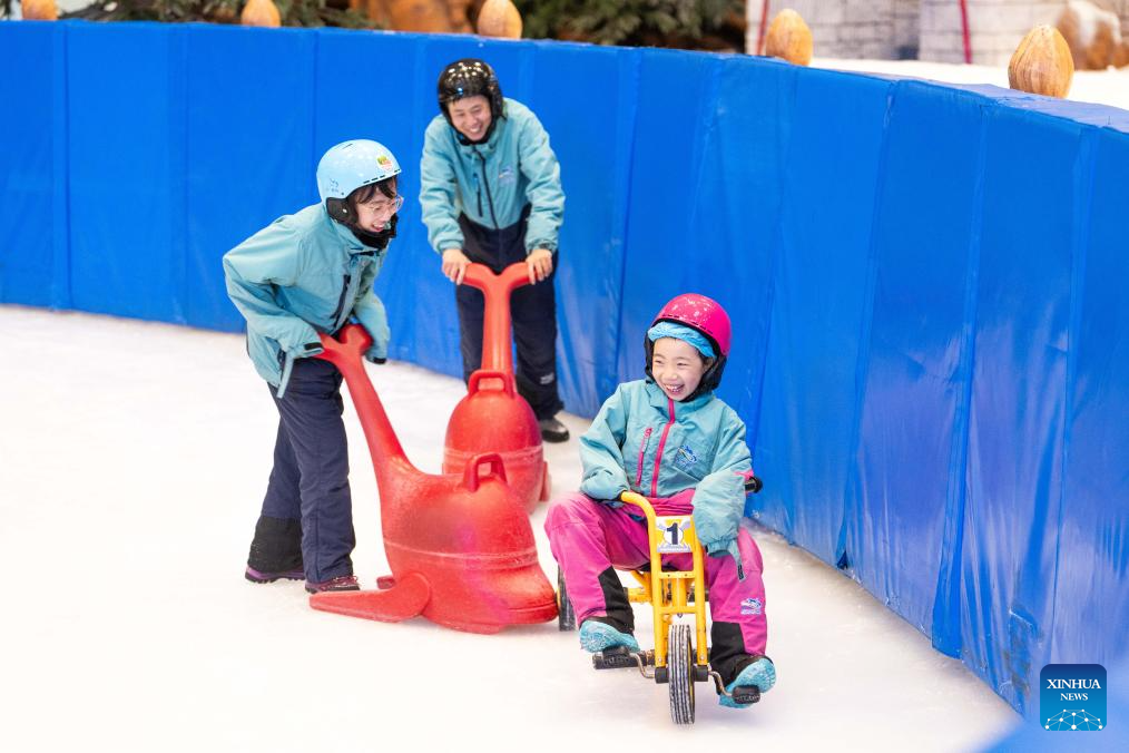 People enjoy themselves at indoor ski resort in Changsha