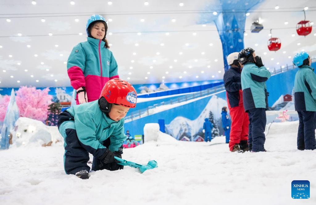 People enjoy themselves at indoor ski resort in Changsha