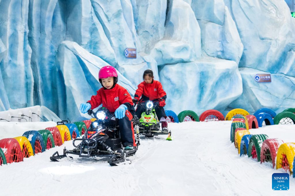 People enjoy themselves at indoor ski resort in Changsha