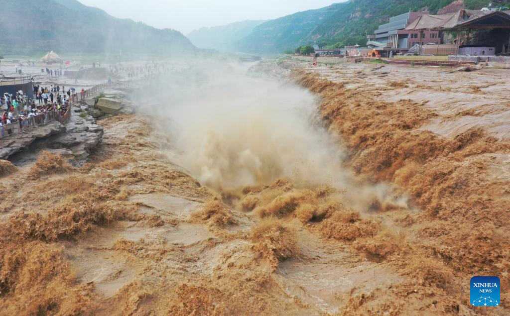 People visit Hukou Waterfall on Yellow River in Jixian County, north China