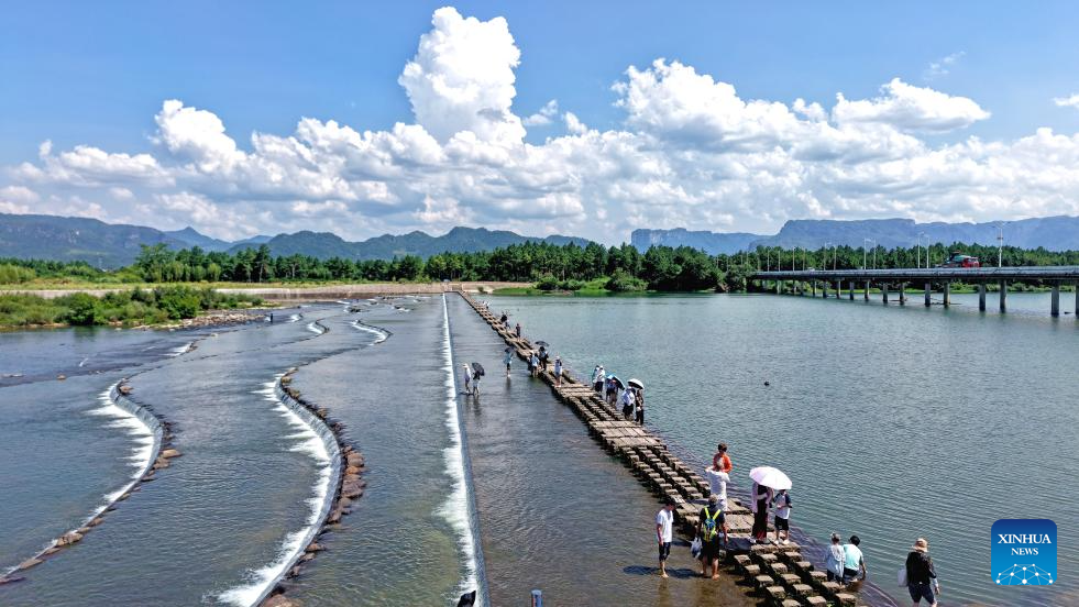 People enjoy summer vacation across China