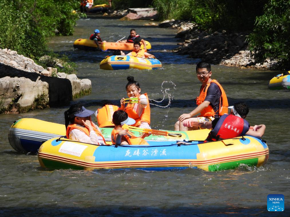 Summer travel in full swing across China
