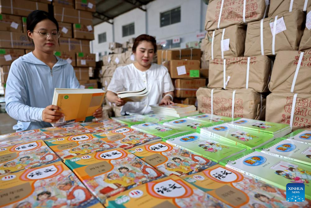 Schools, bookstores across China prepare textbooks for upcoming new semester