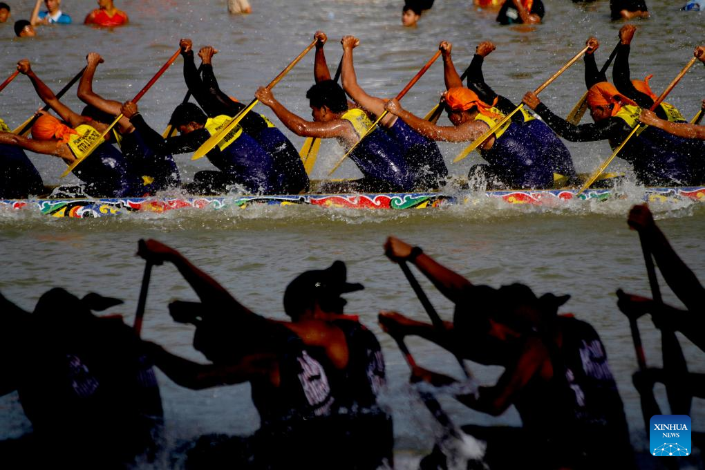 People participate in long boat race to celebrate Pacu Jalur Festival in Indonesia