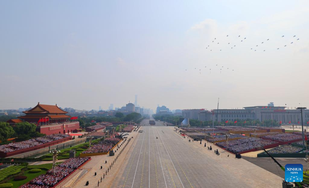 March-past of China's V-Day parade begins with flag-guarding echelon flying over Tian'anmen Square