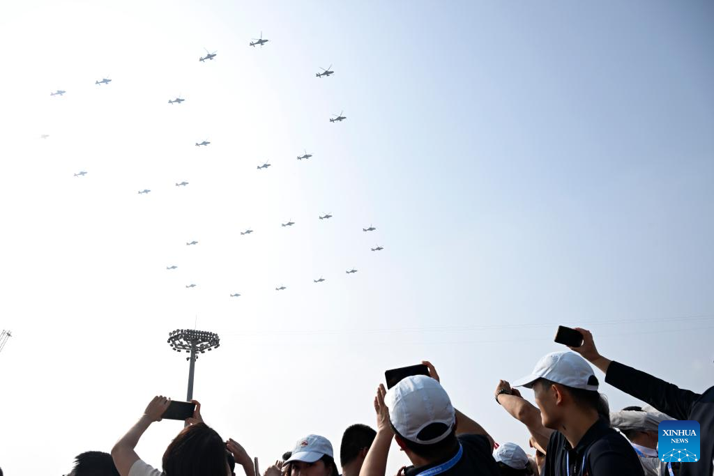 March-past of China's V-Day parade begins with flag-guarding echelon flying over Tian'anmen Square