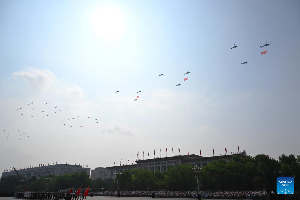 March-past of China's V-Day parade begins with flag-guarding echelon flying over Tian'anmen Square