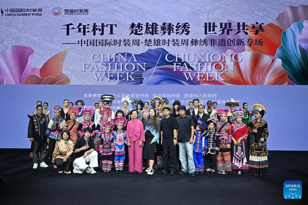 Models present creations featuring embroidery of Yi ethnic group in Beijing