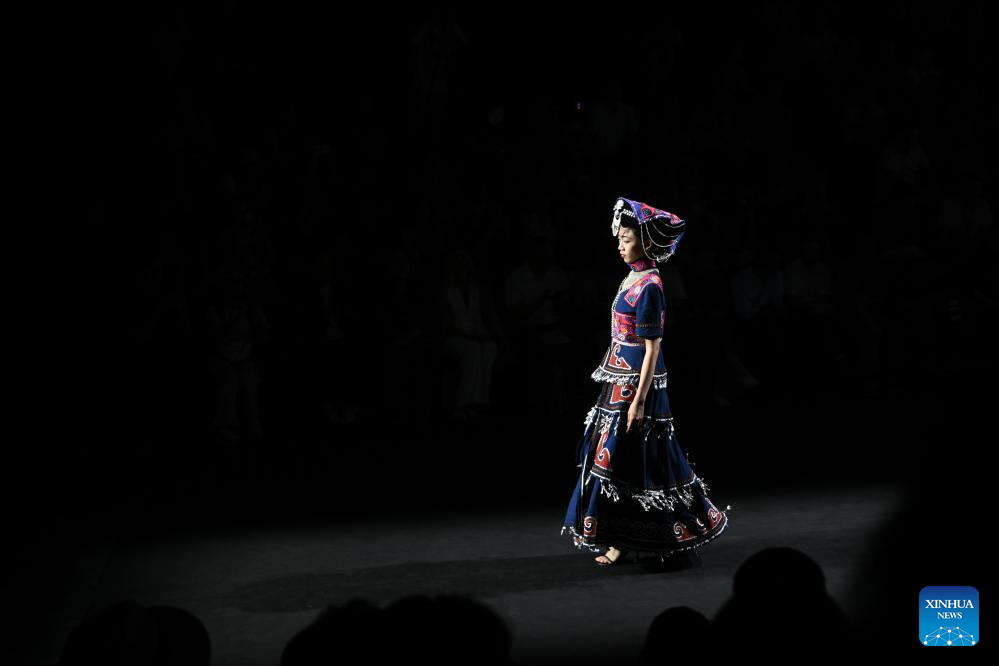 Models present creations featuring embroidery of Yi ethnic group in Beijing