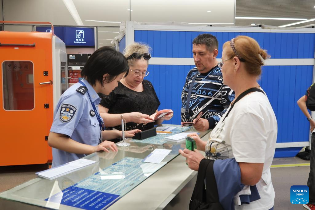 Russian travelers enter China visa-free as new policy takes effect