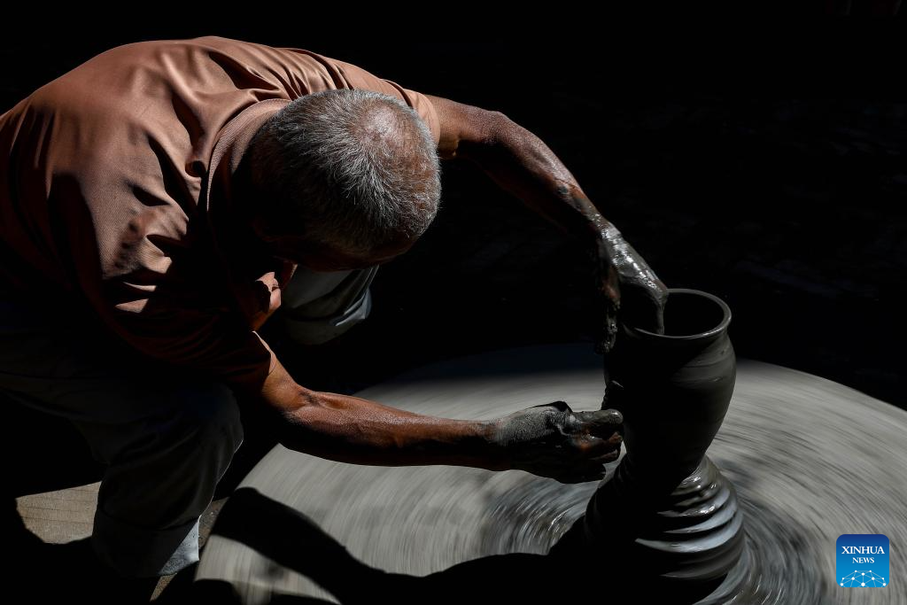 Workers make clay pots for Tihar festival in Bhaktapur, Nepal