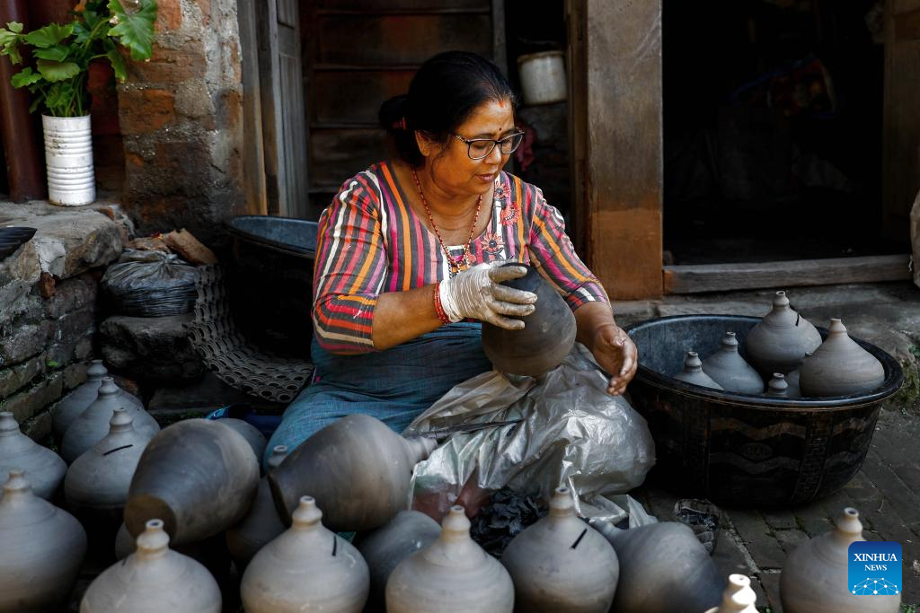 Workers make clay pots for Tihar festival in Bhaktapur, Nepal