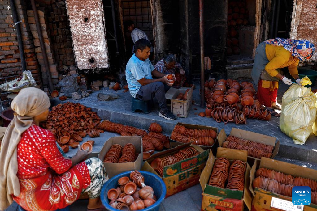 Workers make clay pots for Tihar festival in Bhaktapur, Nepal
