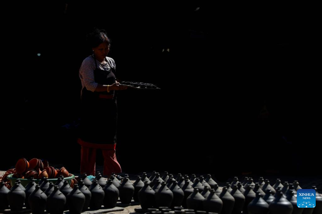 Workers make clay pots for Tihar festival in Bhaktapur, Nepal