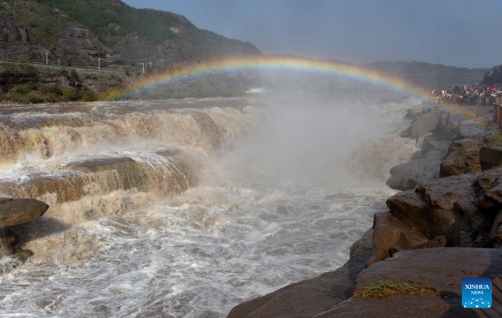 Scenery of rainbow over Hukou Waterfall in China's Shanxi