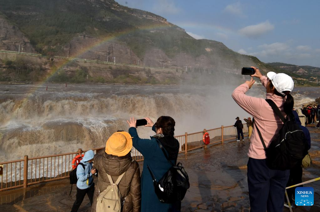 Scenery of rainbow over Hukou Waterfall in China's Shanxi