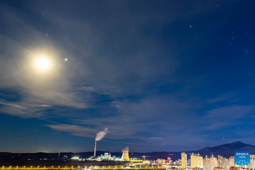 View of moon accompanied by Jupiter, Pollux