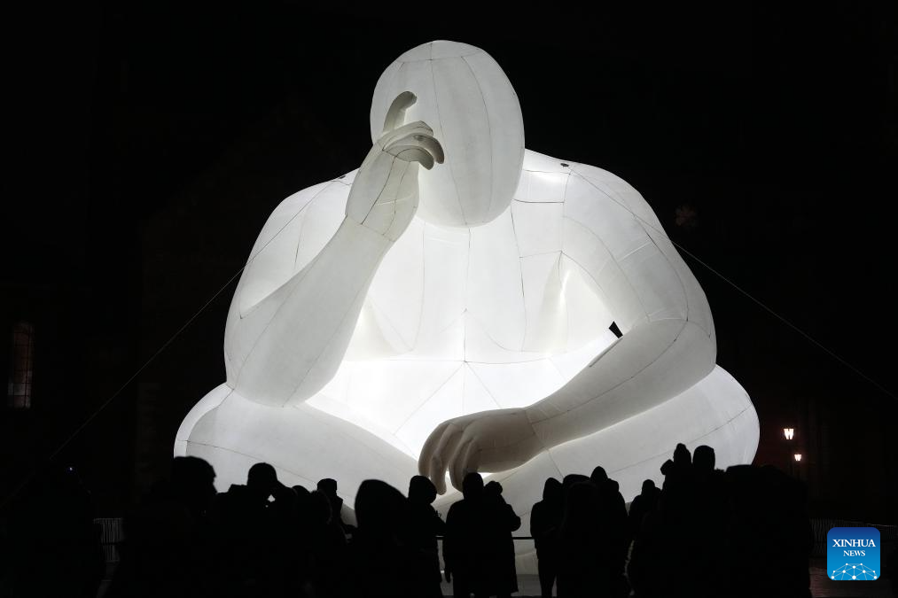 People view light show during light festival 