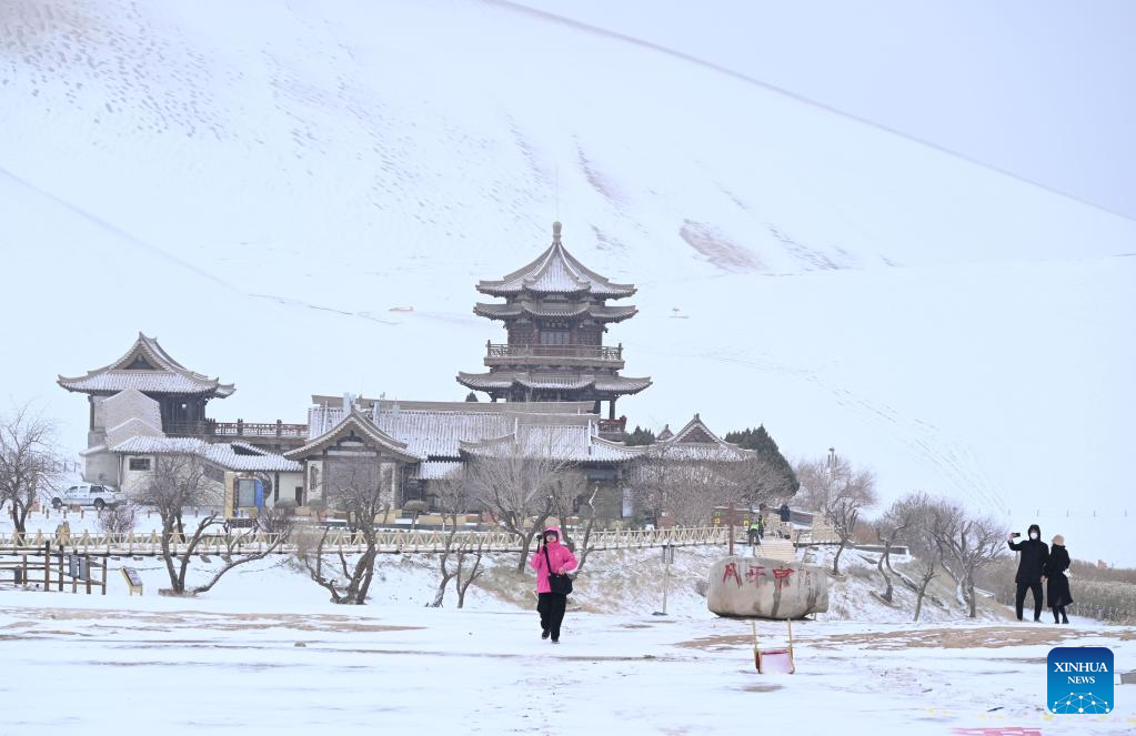 Tourists visit Mingsha Mountain and Crescent Spring Scenic Area in Dunhuang City, NW China