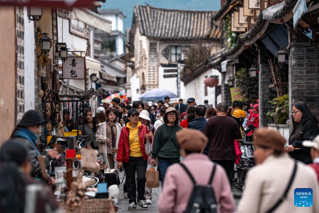 Tourists visit Xizhou old town in Dali City, China's Yunnan