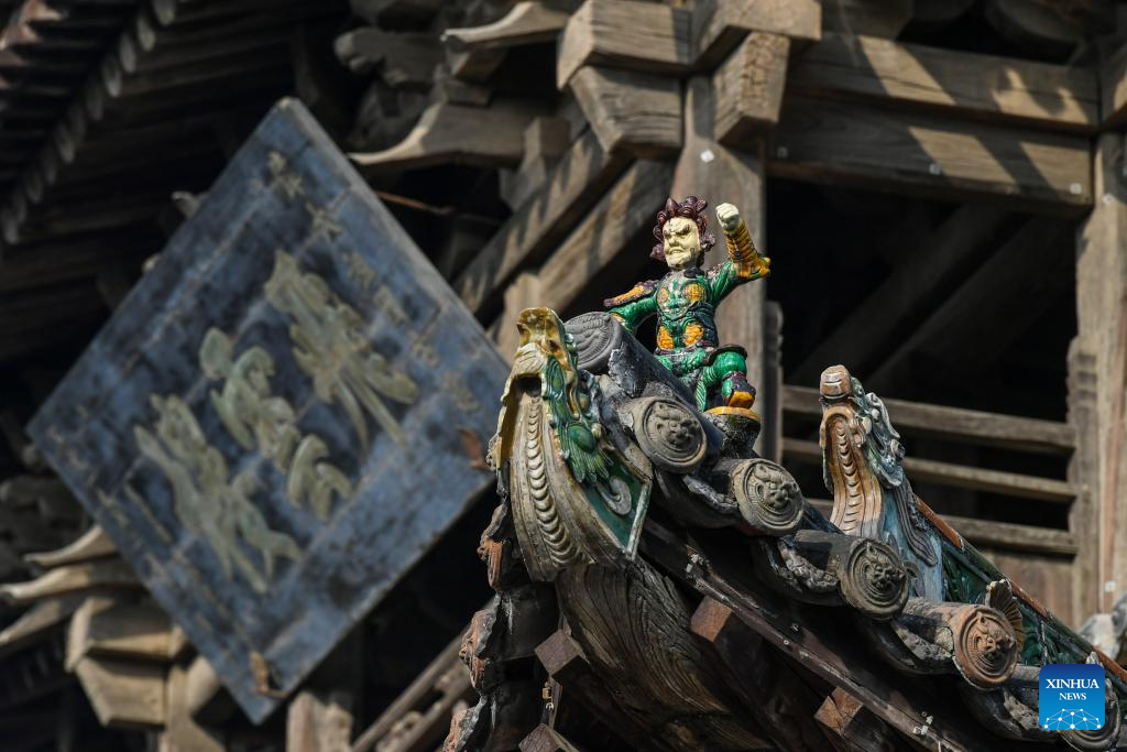 A glimpse of auspicious creatures on rooftops of ancient architecture in China's Shanxi