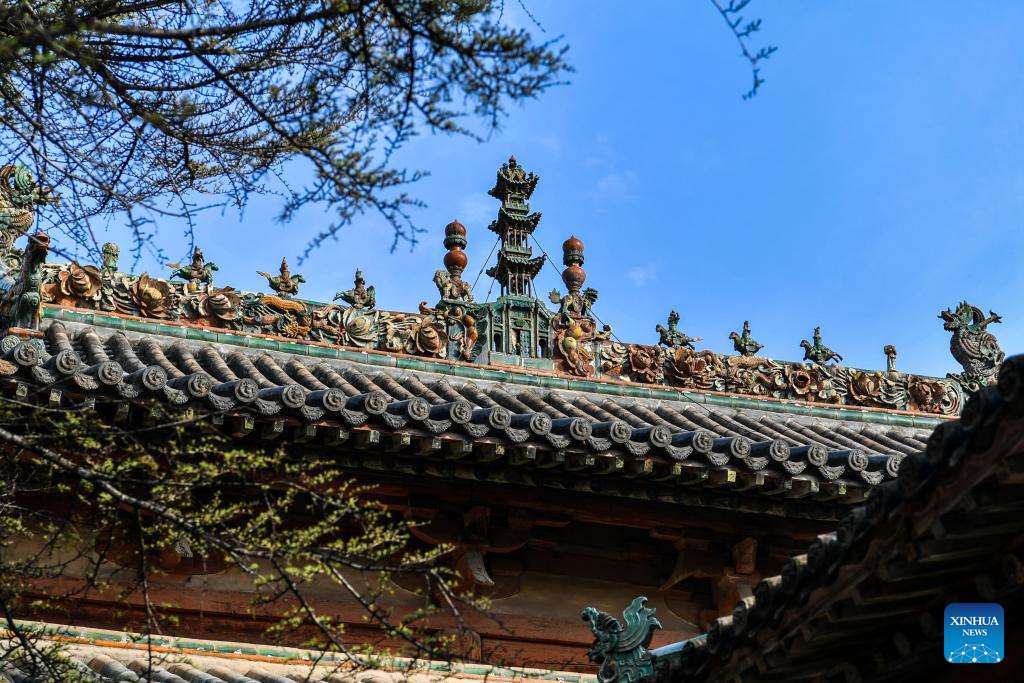 A glimpse of auspicious creatures on rooftops of ancient architecture in China's Shanxi